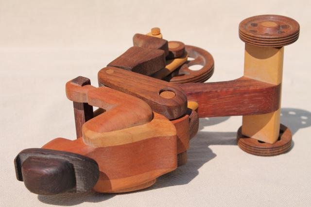 photo of working tricycle wooden toy, handmade wood folk art whimsy, man on wheels #8