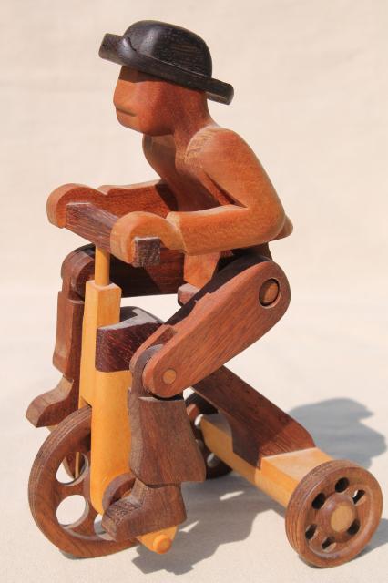 photo of working tricycle wooden toy, handmade wood folk art whimsy, man on wheels #9