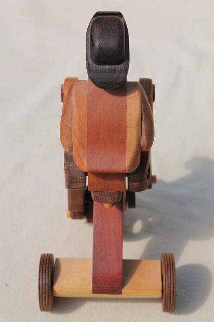 photo of working tricycle wooden toy, handmade wood folk art whimsy, man on wheels #10