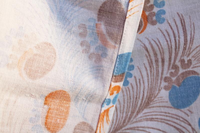 photo of worn soft vintage cotton feedsack fabric, faded print feathers blue & orange #3