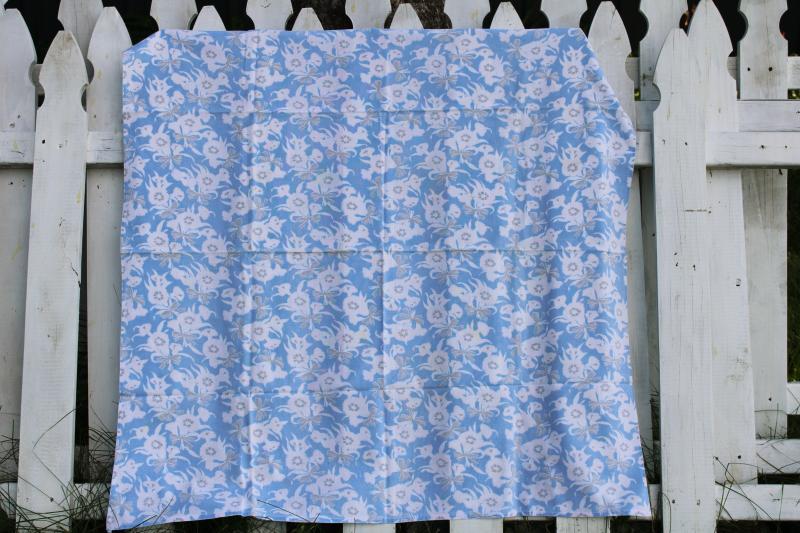 photo of worn soft vintage cotton feedsack fabric, faded print, flowers on blue #1