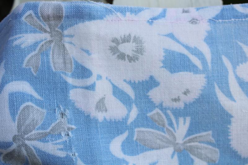 photo of worn soft vintage cotton feedsack fabric, faded print, flowers on blue #2