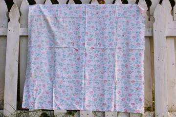 catalog photo of worn soft vintage cotton feedsack fabric, faded print, pink & green flowers