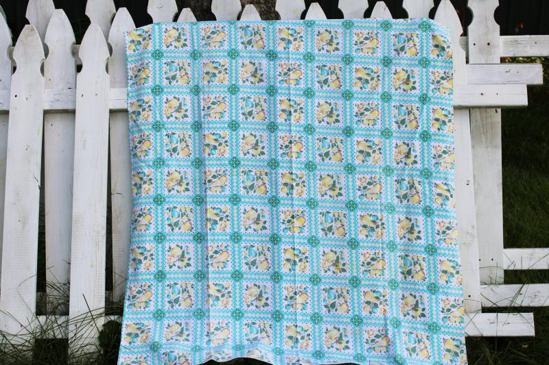 photo of worn soft vintage cotton feedsack fabric, faded print, turquoise & yellow fruit #1