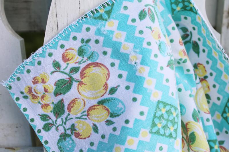 photo of worn soft vintage cotton feedsack fabric, faded print, turquoise & yellow fruit #2