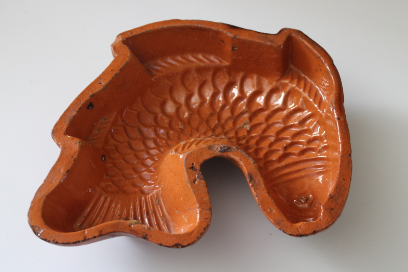 photo of worn weathered old terracotta clay fish mold, antique or vintage brown slip glaze pottery  #1