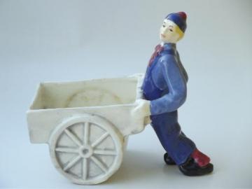 catalog photo of young man w/ pushcart flower planter, vintage California studio pottery